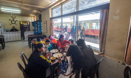 An Indian family eating at the canteen at Shimla railway station, India