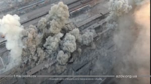 Smoke rises around an industrial compound after multiple explosions in Mariupol