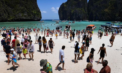 Hundreds of tourists wandering around Maya Bay.