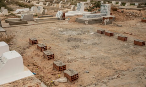 Tombs of refugees buried in 2022, with bricks instead of gravestones, in a cemetery near Sfax.