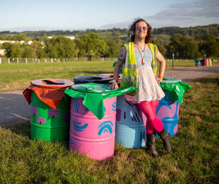 Bertram Holt, AKA Bertram: That Geezabird, stands beside a collection of bins at sunset