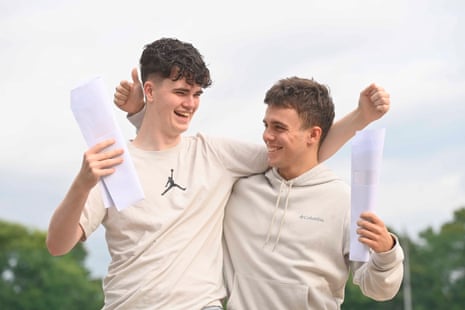 Students Ruairi Coyle and Michael Allena celebrate their A-level results at Our Lady and St Patricks College Knock in Belfast.