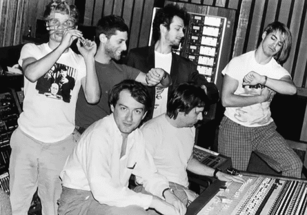 Andy Gill in the studio working on the Red Hot Chili Peppers’ first album. Flea stands behind him, left.