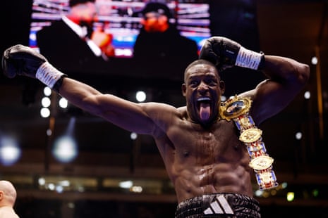 Richard Riakporhe celebrates with his British heavyweight title.