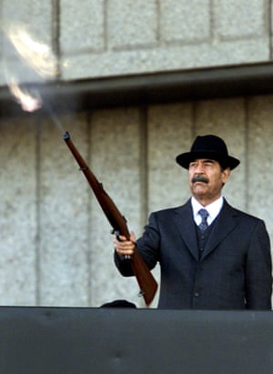 Iraqi President Saddam Hussein firing shots in the air, 31 December, 2000.