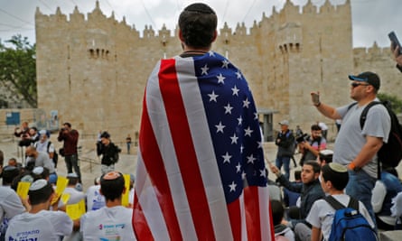An Israeli man draped in the stars and stripes at Damascus gate in Jerusalem on Sunday