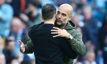 Roberto De Zerbi gets a hug from Pep Guardiola
