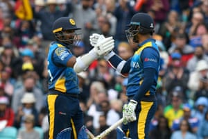 Perera and Karunaratne celebrate their century parntership.