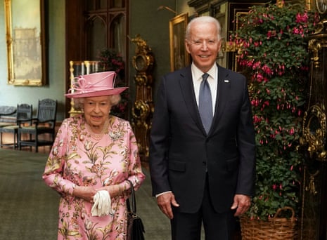 Queen Elizabeth II with US President Joe Biden in the Grand Corridor during their visit to Windsor Castle in 2021.