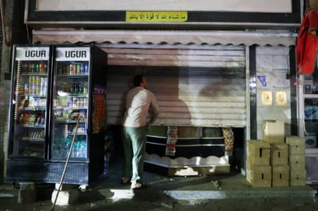 A man closes his shop early in Cairo