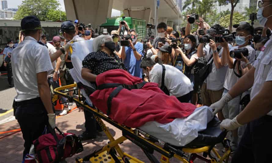 A pro-democracy protester is taken to hospital after falling sick outside a court in Hong Kong