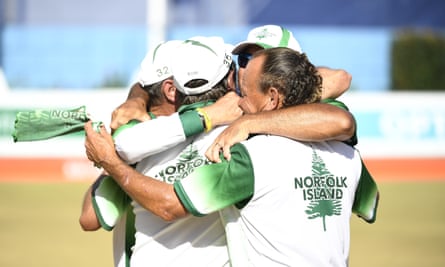 Hadyn Evans and Ryan Dixon of Norfolk Island celebrate after winning the Bronze medal in the Mens Lawn Bowls Triples match against Canada.