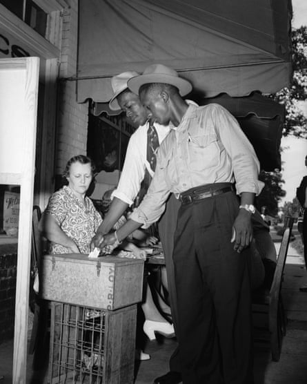 In Mississippi, two African American men vote for the first time in the 1946 Democratic primary. Many southern states have persisted with Jim Crow-era laws the disproportionately impact black voters.