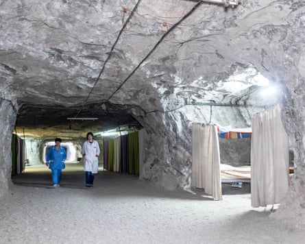 Doctor and nurse walk through salt cavern