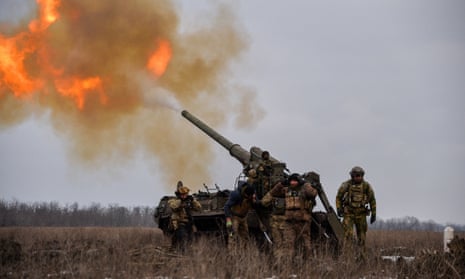 Ukrainian artillery teams fire toward Russian positions in Bakhmut.