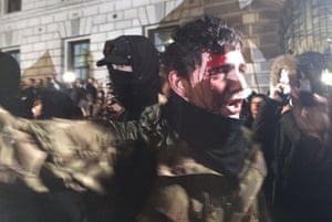 A protester with a bloodied head during the Million Mask march