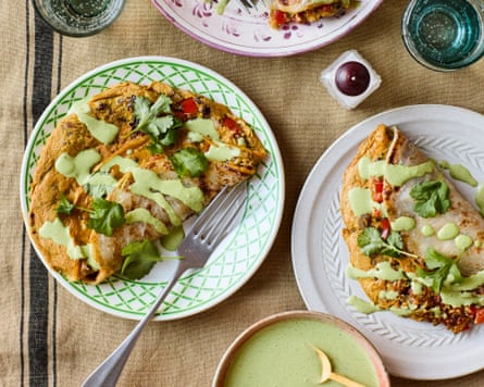 Rukmini Iyer’s chapati omelette rolls on a table with other crockery and cutlery