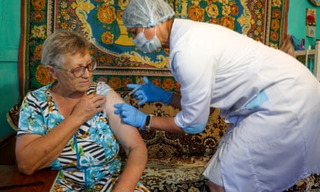 A woman receives a shot of the EpiVacCorona vaccine in the village of Talovka, Kamyshin District, Russia.