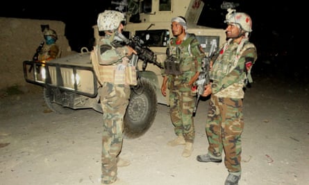 Afghan special force members take part in a night military operation against Taliban in the Nad Ali district of Helmand.