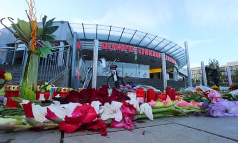 Candles and flowers in front of the shopping centre in Munich where an 18-year-old German-Iranian student shot nine people dead on 22 July.