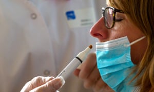 A patient infected with Covid-19 receives an olfactory test.