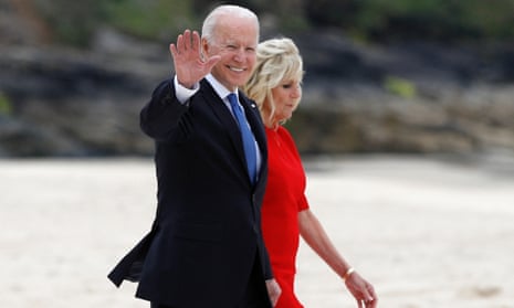 Joe Biden waves as he walks with Jill Biden in Carbis Bay, Cornwall. 