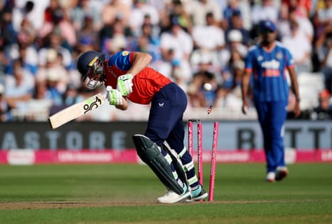 England's Jos Buttler is bowled out by India's Prince Yadav.