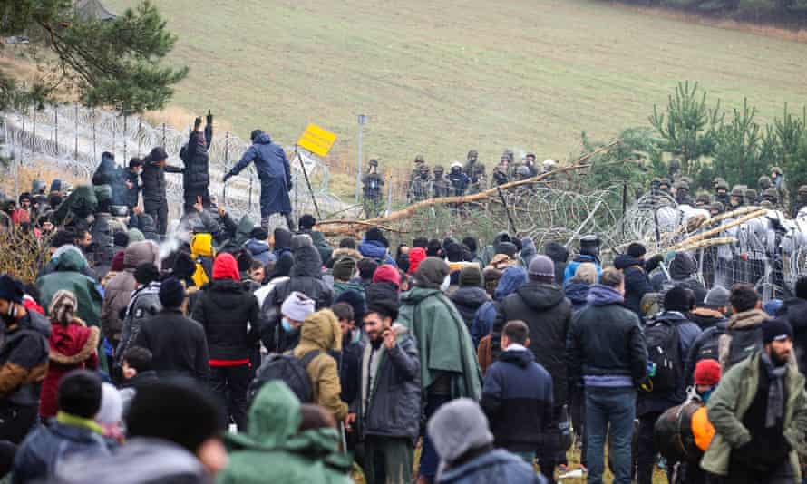 Migrants gather on the Belarusian-Polish border