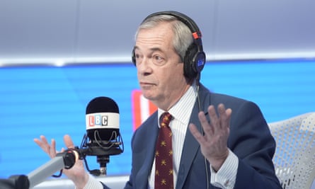 The leader of the UK reform, Nigel Farage, holds his hands up while talking in a microphone with LBC Branding. Credit: Pa/Stefan Rousseau