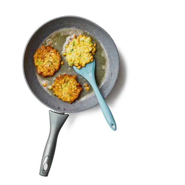 Frying the fritters. Stir until all the vegetables are coated with batter, then put enough oil into a frying pan to just cover the base. Put on a medium-high heat and, once hot enough that a piece of corn sizzles, drop rounded spoonfuls of the mixture into the pan and flatten very slightly. Make sure to leave enough room between them that you can flip them easily – you’ll probably need to cook them in two or more batches.