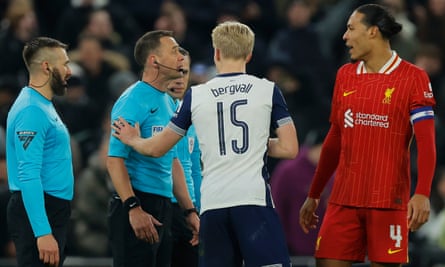 Virgil van Dijk (right) speaks to referee Stuart Attwell after the final whistle as Lucas Bergvall gets involved.