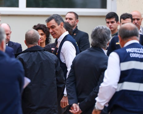 Spanish PM Pedro Sánchez (centre) arrives at the meeting of the centre managing rescue work