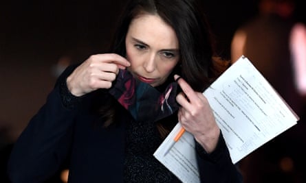 New Zealand Prime Minister Jacinda Ardern puts her mask on after speaking at the Business NZ Election Conference