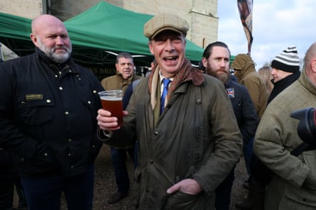 Nigel Farage with a pint of beer at a trail hunt meet in Kent