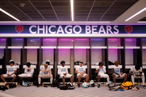The NFL Academy players gather their thoughts in the home dressing room, that has already been rebranded for the Chicago Bears, ahead of their match against De La Salle Spartans.