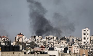 Black smoke rises over buildings in Gaza City