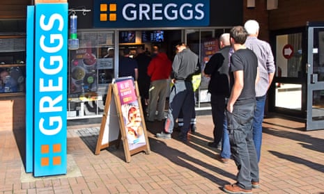 Men queuing to enter a Greggs bakery in Cheshire
