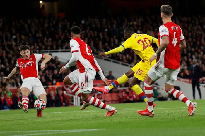 Crystal Palace’s Christian Benteke smacks the ball past Arsenal’s goalkeeper Aaron Ramsdale to get the Eagles back on level terms.