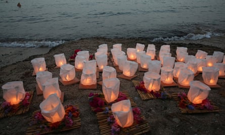 Relatives and friends of the fire victims at Mati light lanterns in their memory on the fifth anniversary of the blaze.