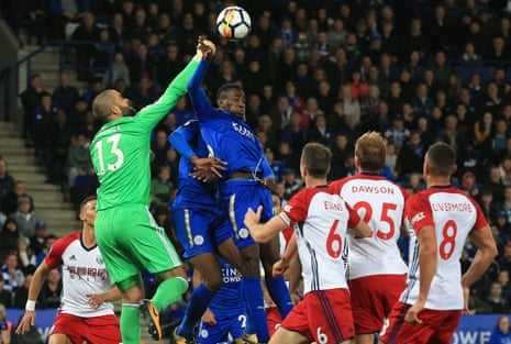 Baggies’ keeper Boaz Myhill punches the ball away from the head of Leicester City’s Wilfred Ndidi.