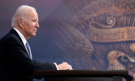 A portrait of Joe Biden. In the background, the eagle that forms the great seal of the United States can be seen.