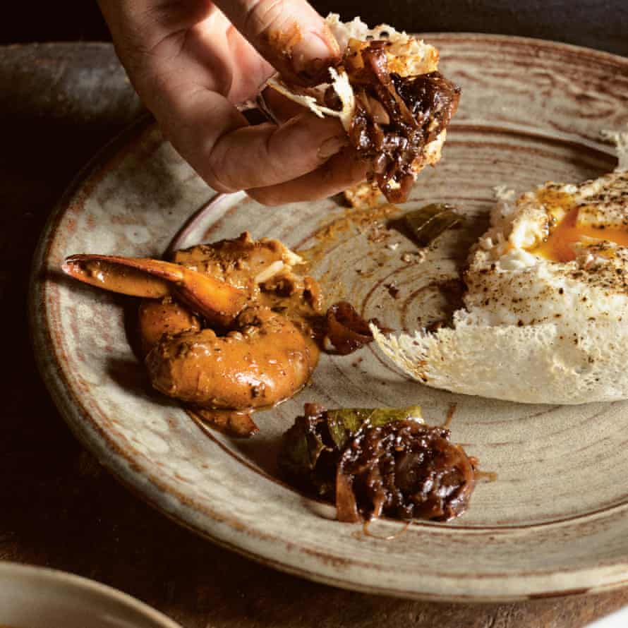 Prawn curry – shown here with a variety of other accompaniments to O Tama Carey’s hopper