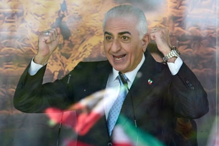 Pahlavi smiling and holding up his fists