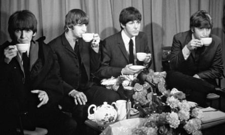 The Beatles sipping tea in 1965.