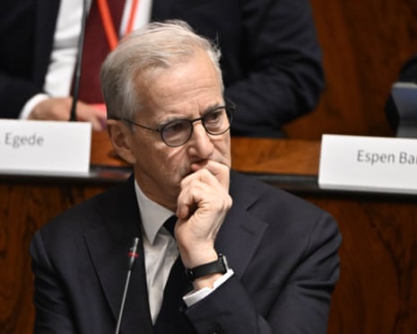 Norway's PM Jonas Gahr Støre rests his chin on his hand, looking thoughtful at a desk
