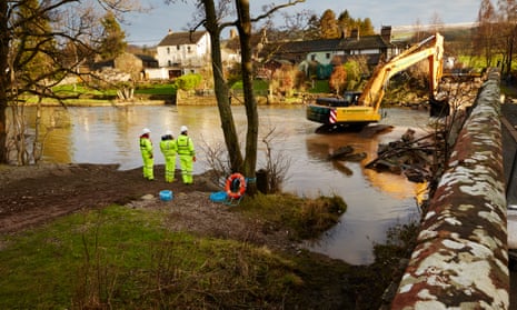 Contractors removing Pooley Bridge in Ullswater, Cumbria, which collapsed in heavy storms last December