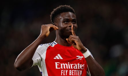 Bukayo Saka celebrates scoring from the penalty spot for Arsenal’s fourth