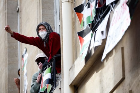 Masked youths take part in the occupation of a building of the Sciences Po university.