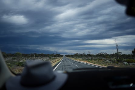 Rain falls on the Nullarbor Plain along the Eyre Highway in Western Australia.