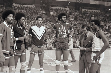 Julius Erving (32), Larry Kenon (35), George Gervin (44), Artis Gilmore (53) and David Thompson (33) look on before the 1976 ABA slam dunk contest in Denver.